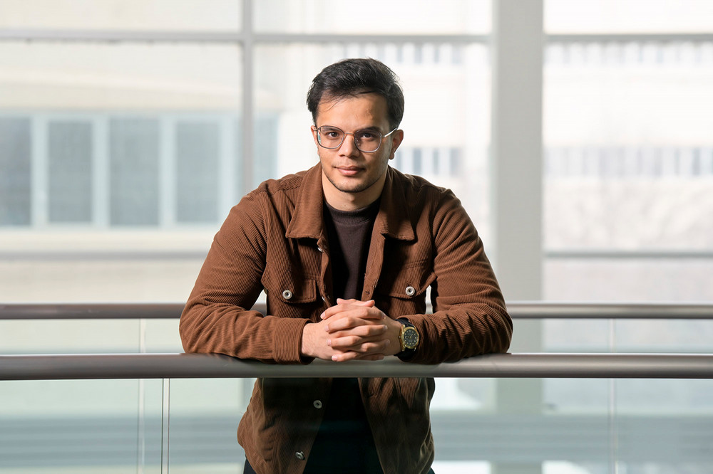 man leaning on a railing