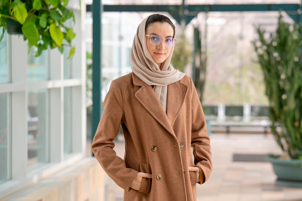 Young woman standing indoors