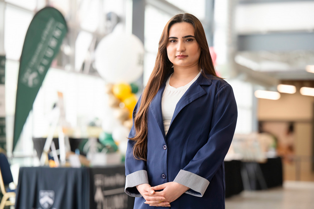 woman standing in a hallway