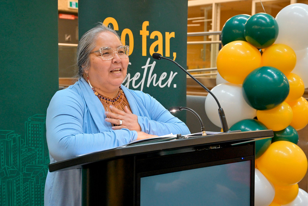 a woman speaking at a podium