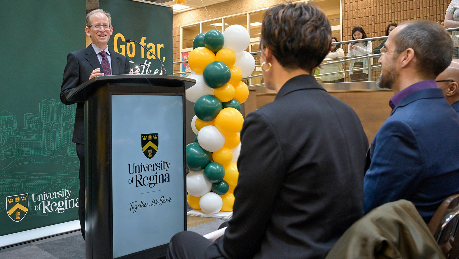 man speaking at a podium