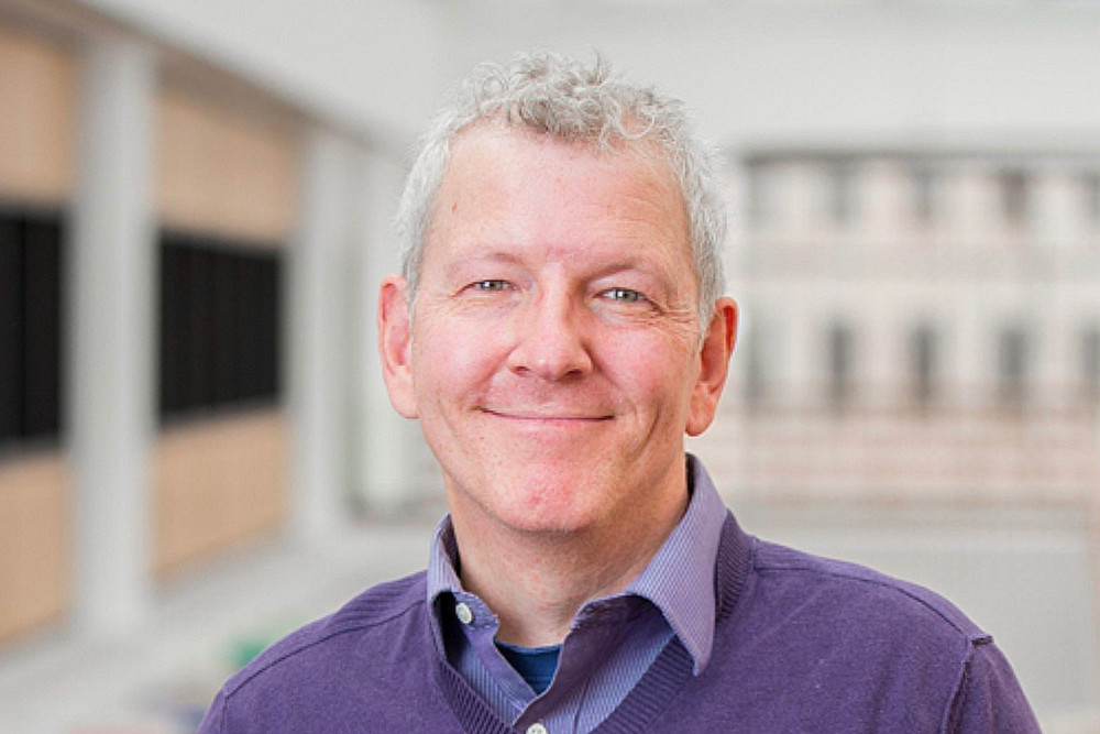 Dr. Piers Steel, professor at the University of Calgary, smiling in a professional headshot.