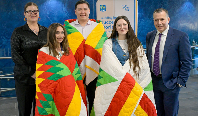 Five smiling individuals