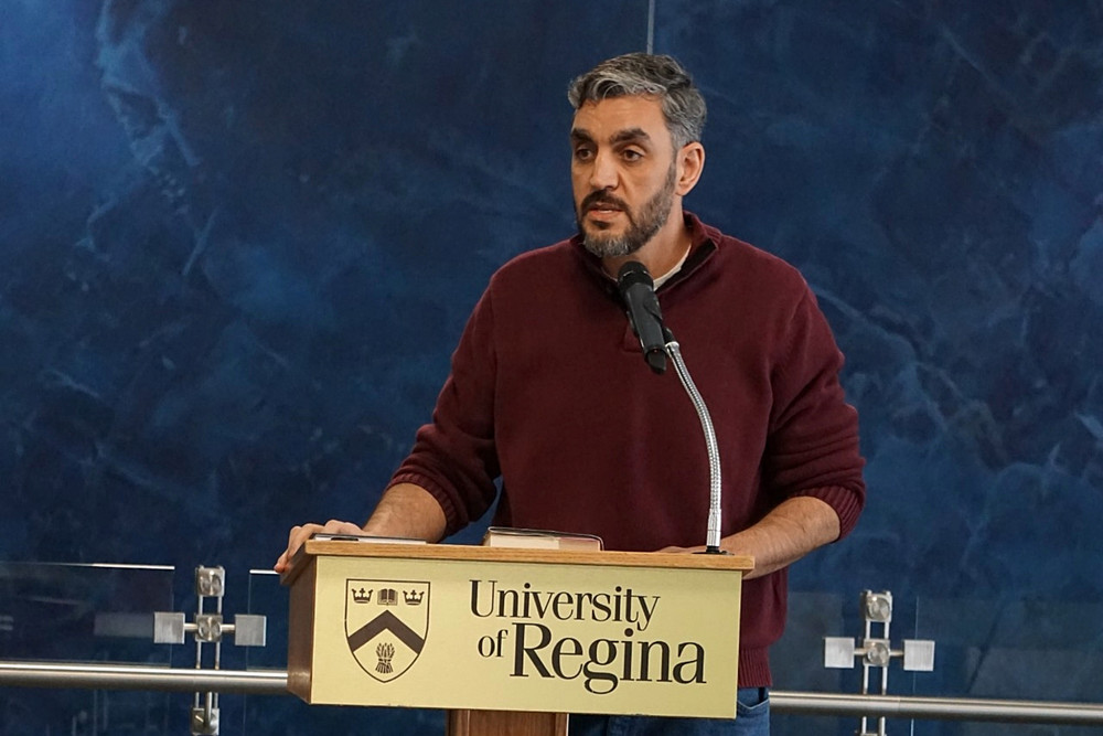 a man speaking at a podium
