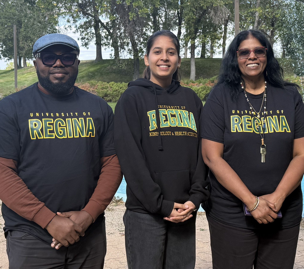 Two members of the EDI Digital Resource Hub project team sit beside cameras on tripods in a meeting room, with filming equipment set up for an interview.