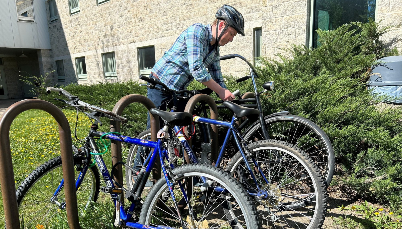 person locking up a bike