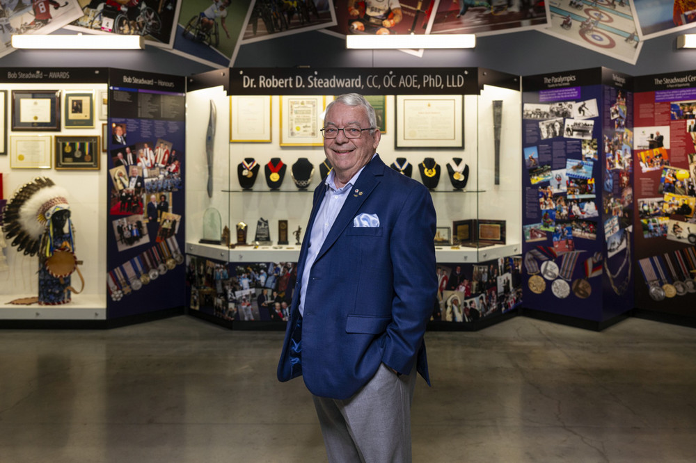 a smiling man in a museum