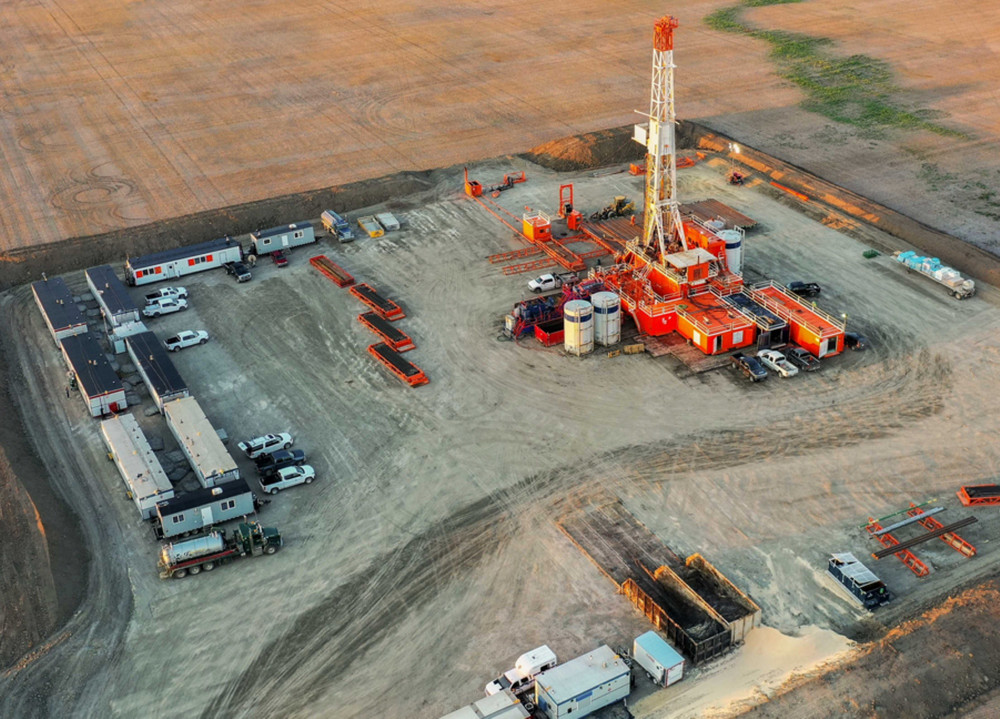 Aerial view of Prairie Lithium's extraction infrastructure and drilling rig surrounded by rural Saskatchewan fields