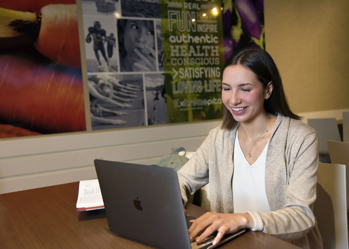 a woman using a laptop computer