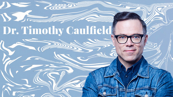 a headshot of a man wearing a blue shirt