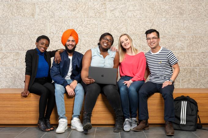 Five students posing for a photo