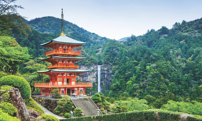 Asian building in a forest landscape.