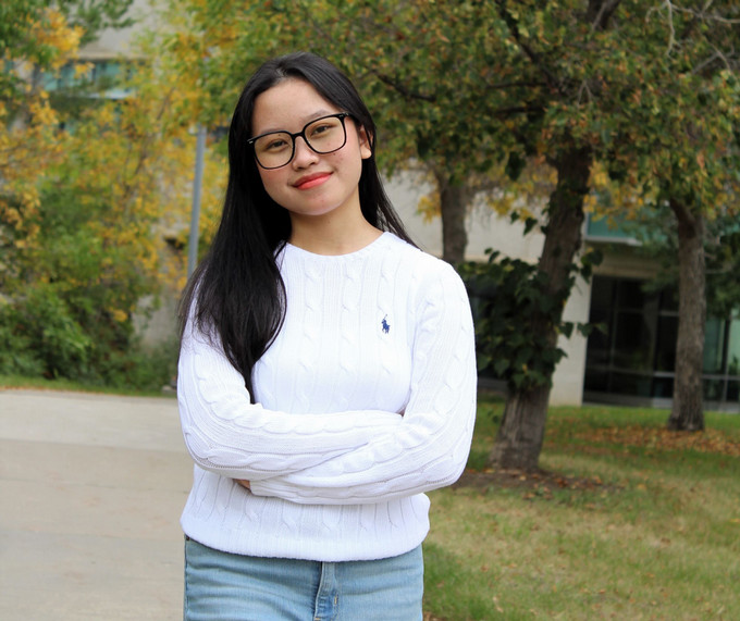 Girl standing outside.