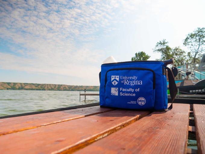 Picture of testing kit placed on a dock alongside a lake.