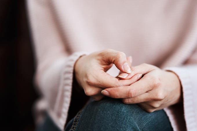 Image of woman's hands in lap